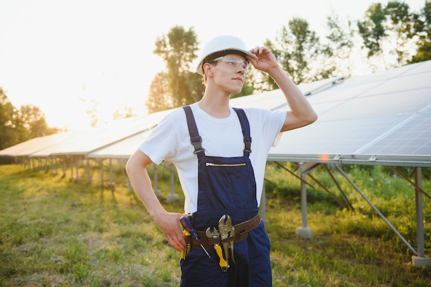 Worker installing solar panels outdoors