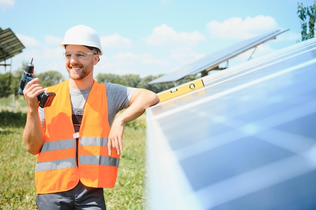 Worker installing solar panels outdoors