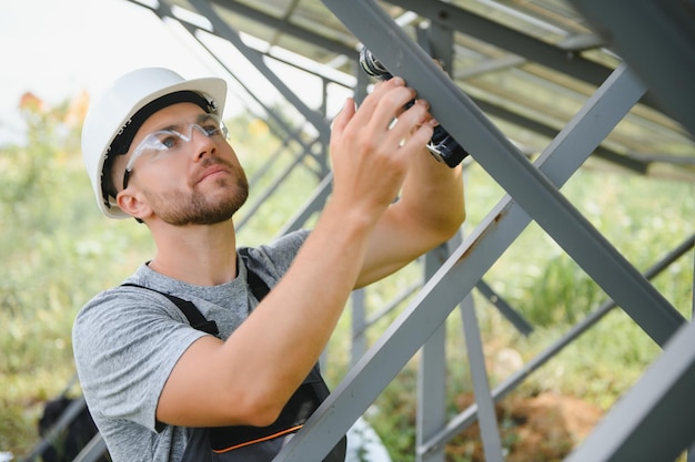 Worker installing solar panels outdoors