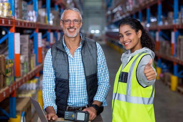 Worker is posing with thumbs up close up to her manager