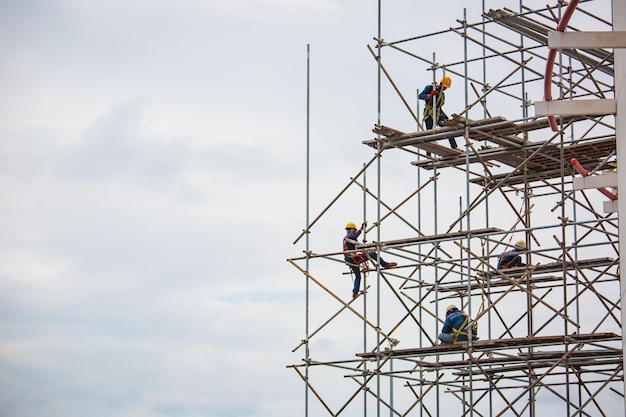 Worker male assembly in progress storage new tank oil inspection scaffolding