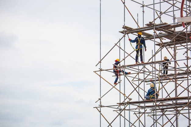 Worker male assembly in progress storage new tank oil inspection scaffolding