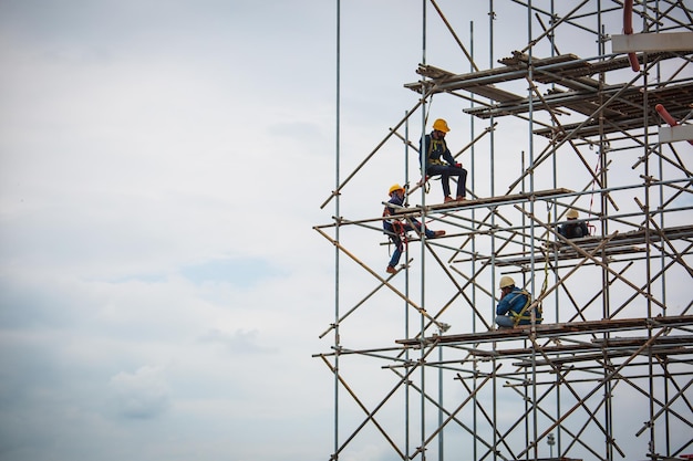 Worker male assembly in progress storage new tank oil inspection scaffolding