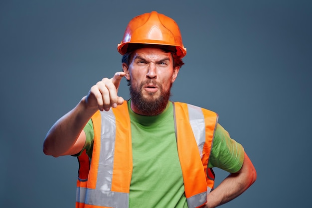 Worker man orange hard hat safety Professional blue background