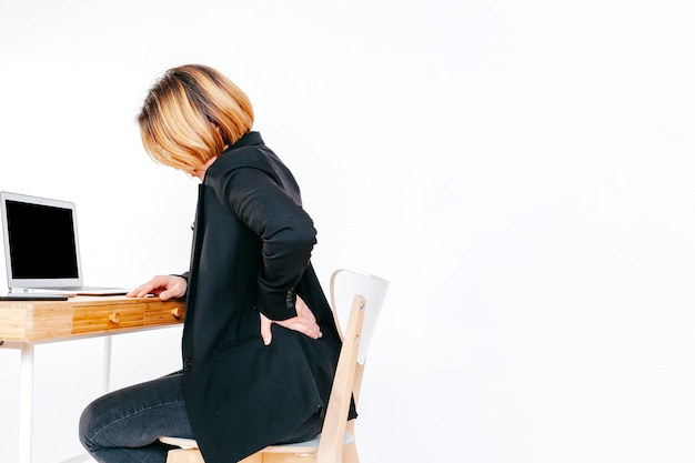 Worker of office having back ache