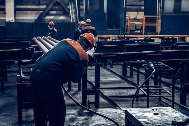 Worker at steel factory or pipe mill located in taganrog south of russia