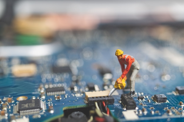 Worker team of engineers repairing keyboard computer laptop