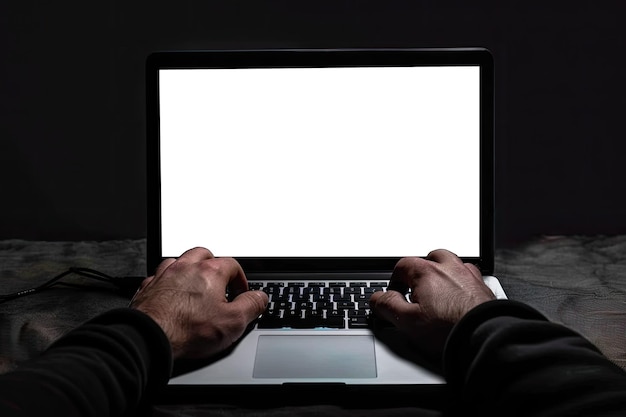 A worker typing on a laptop