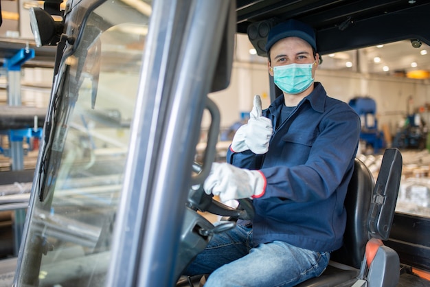 Worker using a forklift