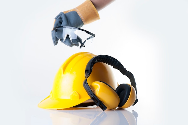 Worker wear leather glove and pick up the safety glass on white background.