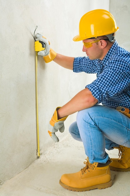 Worker with tape measure