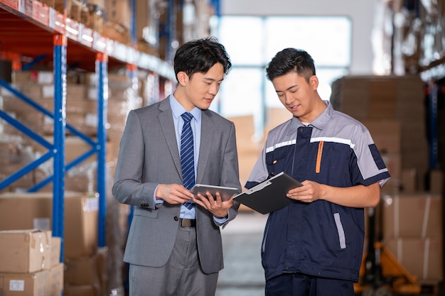 Worker working use radio to communicate in the large warehouse