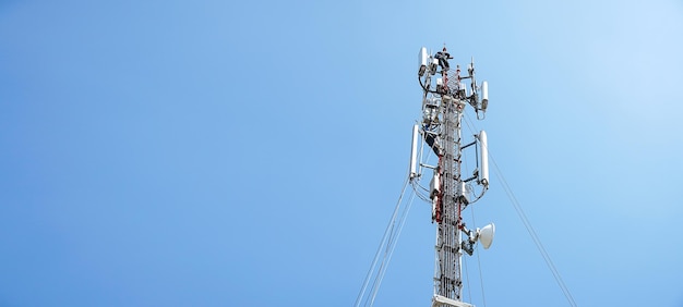 Workers are working at 5g antenna tower for maintainingserves cellular antenna technician worker