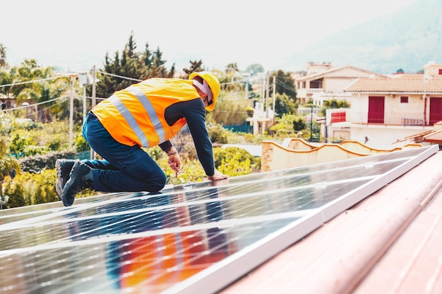 Workers assemble energy system with solar panel for electricity