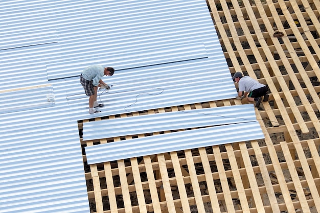 Workers building roof