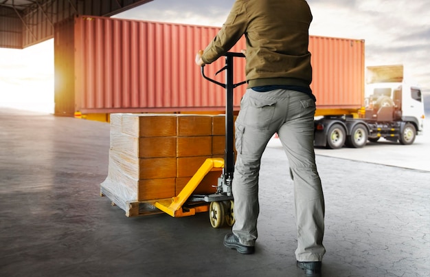 Workers Courier Unloading Packaging Boxes on Pallet to Cargo Container Shipping Freight Trucks