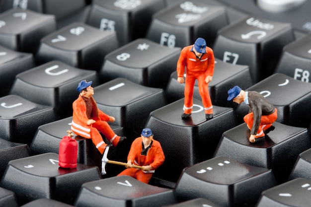 Workers repairing keyboard