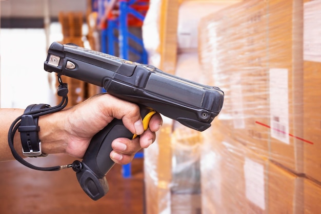 Workers Scanning Bar Code Scanner on Packaging Boxes Storage Supplies Warehouse Inventory Managment