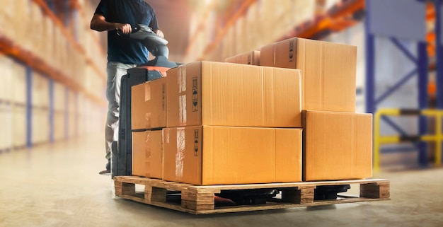 Workers Unloading Packaging Boxes on Pallet in The Warehouse Shipping Supplies Warehouse Logistics