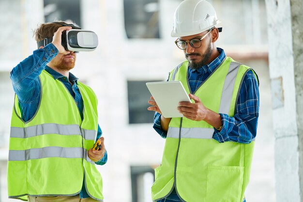 Workers Using Visual Simulation on Site