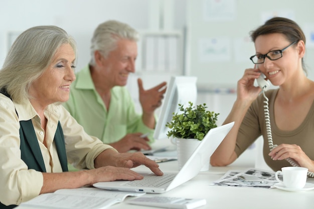 Working business people in modern light office