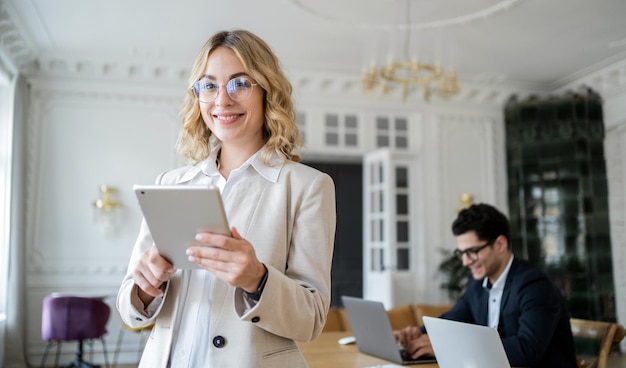 Working on a business project colleagues meet a team of a woman and a man in business suits