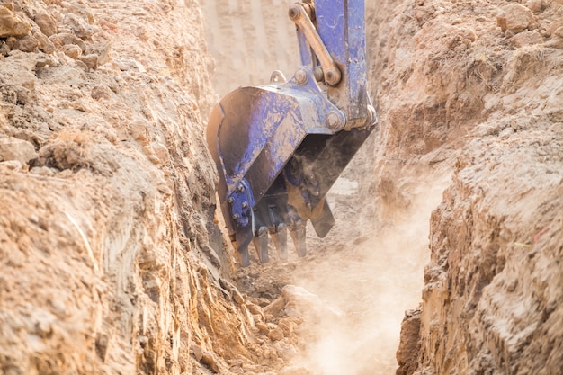 Working Excavator Tractor Digging A Trench.