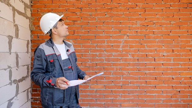 Working man with draft on site