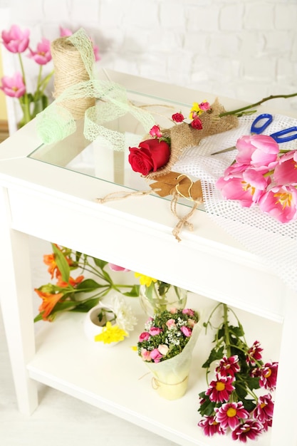 Working place of florist On light background Conceptual photo