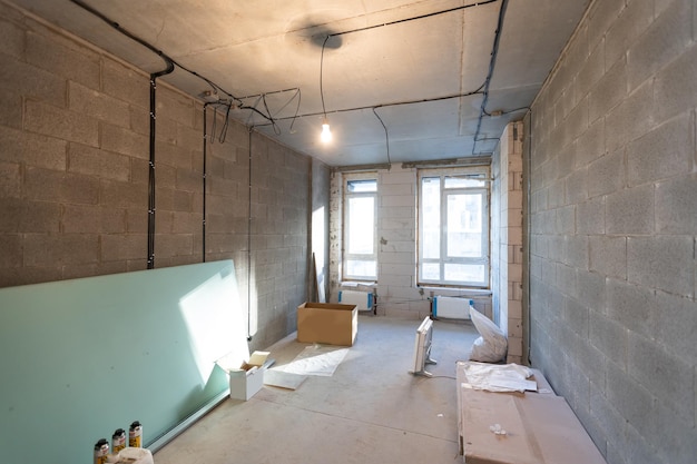 Working process of installing metal frames for plasterboard -drywall - for making gypsum walls in apartment is under construction, remodeling, renovation, extension, restoration and reconstruction.