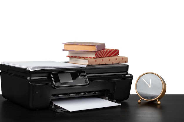 Working table with printer and stacked books on white abckground