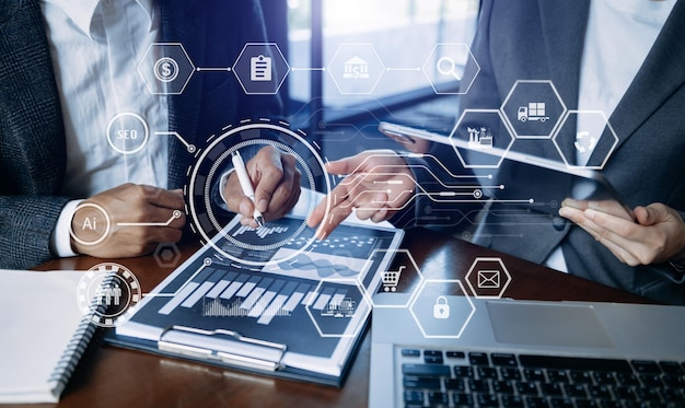 Working team meeting concept business using laptop and smart phone and digital tablet computer with digital marketing media in virtual icon network diagram office in morning lightxA