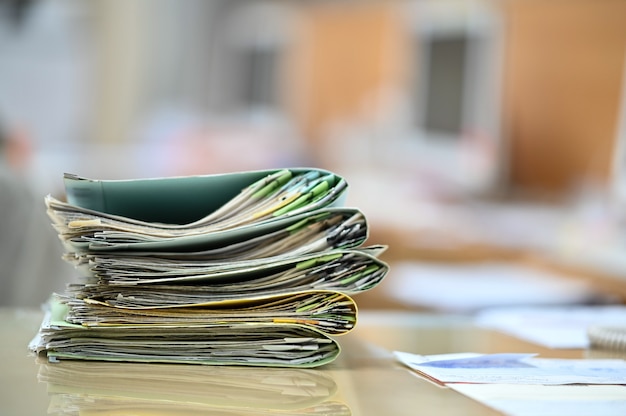 Working women searching for files on their desks