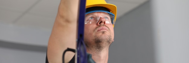 Workman on ladder at job