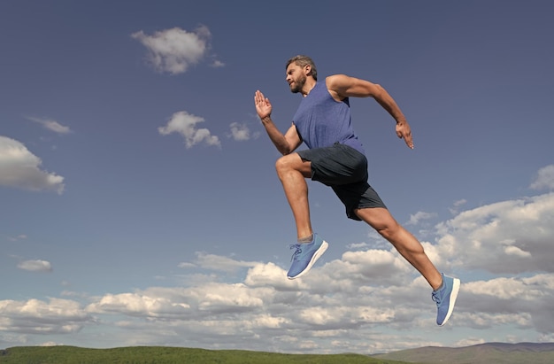 Workout activity healthy man jumping fitness guy in sportswear full of energy