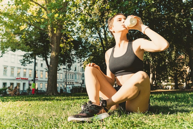 Workout stretching sports on coast in summer in park