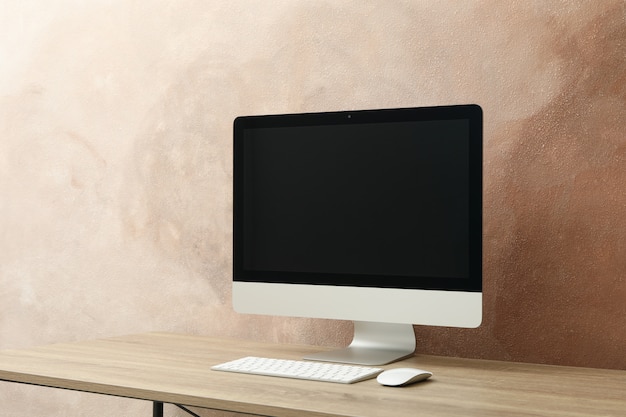 Workplace. Computer and keyboard on wooden table.