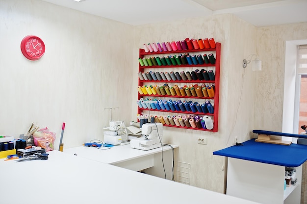 Workplace of seamstress office with sewing machine on table