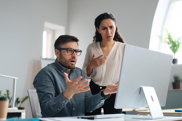 Workplace stress angry female boss scolding stressed male employee for making mistake in business