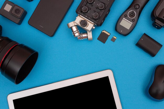 Workplace with digital gadgets on blue table