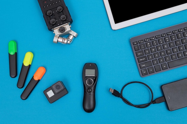 Workplace with digital gadgets on blue table