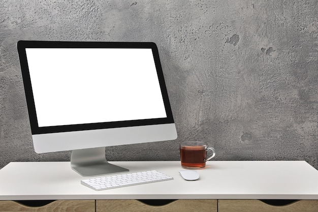 Workplace with modern computer monitor keyboard and mouse on table Mockup for design