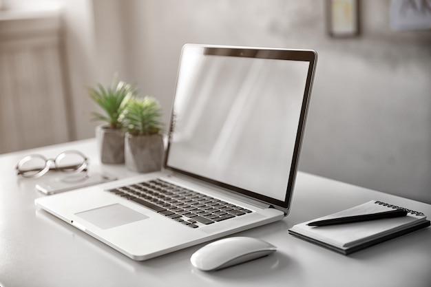 Workplace with modern laptop on table