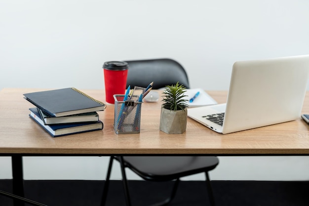 Workplace with notepad pen calculator laptop coffee and keyboard