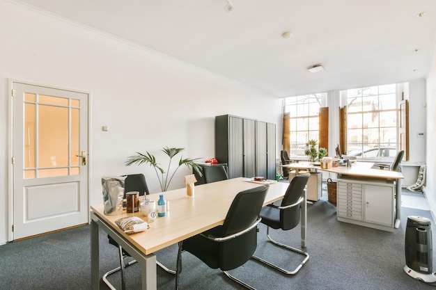 Workplaces in a bright, modern room. The room with modern computers and bookshelves