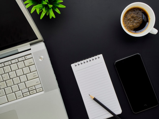 Workspace mockup with laptop, smartphone.