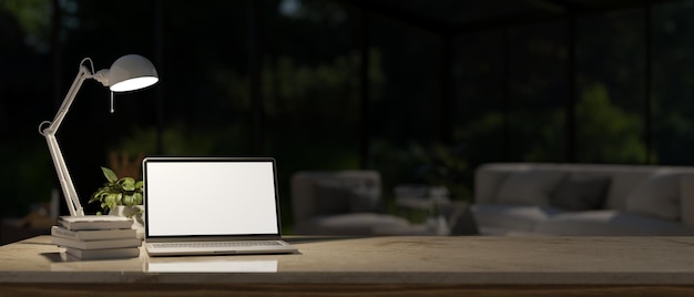 Workspace at night with blurred dark room in the background laptop computer mockup