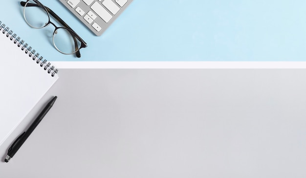 Workspace Real photo, graphic, striped background in pastel colors light gray and blue, white.