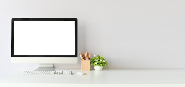 Workspace with mockup computer and office supplies with copy space office desk table.