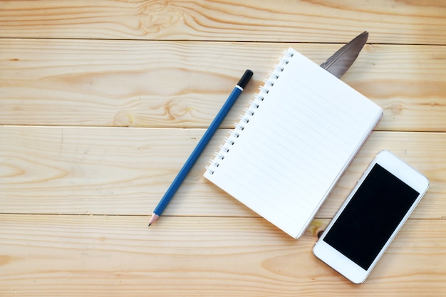 workspace with smartphone on wooden background